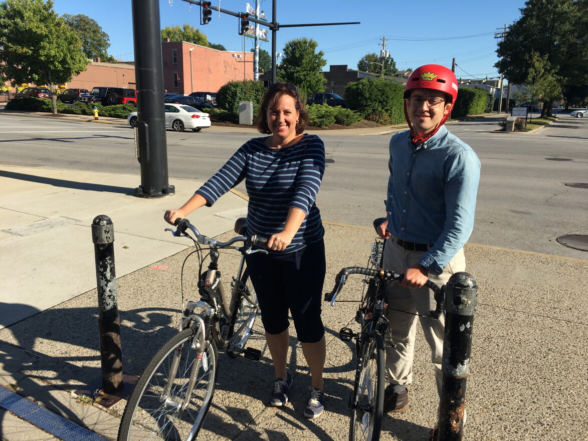 From left: Project Chair Rachel Comte and Wade Johnston with Green Umbrella stand just off the foot of the Purple People Bridge where a temporary bike lane will be on Saratoga.